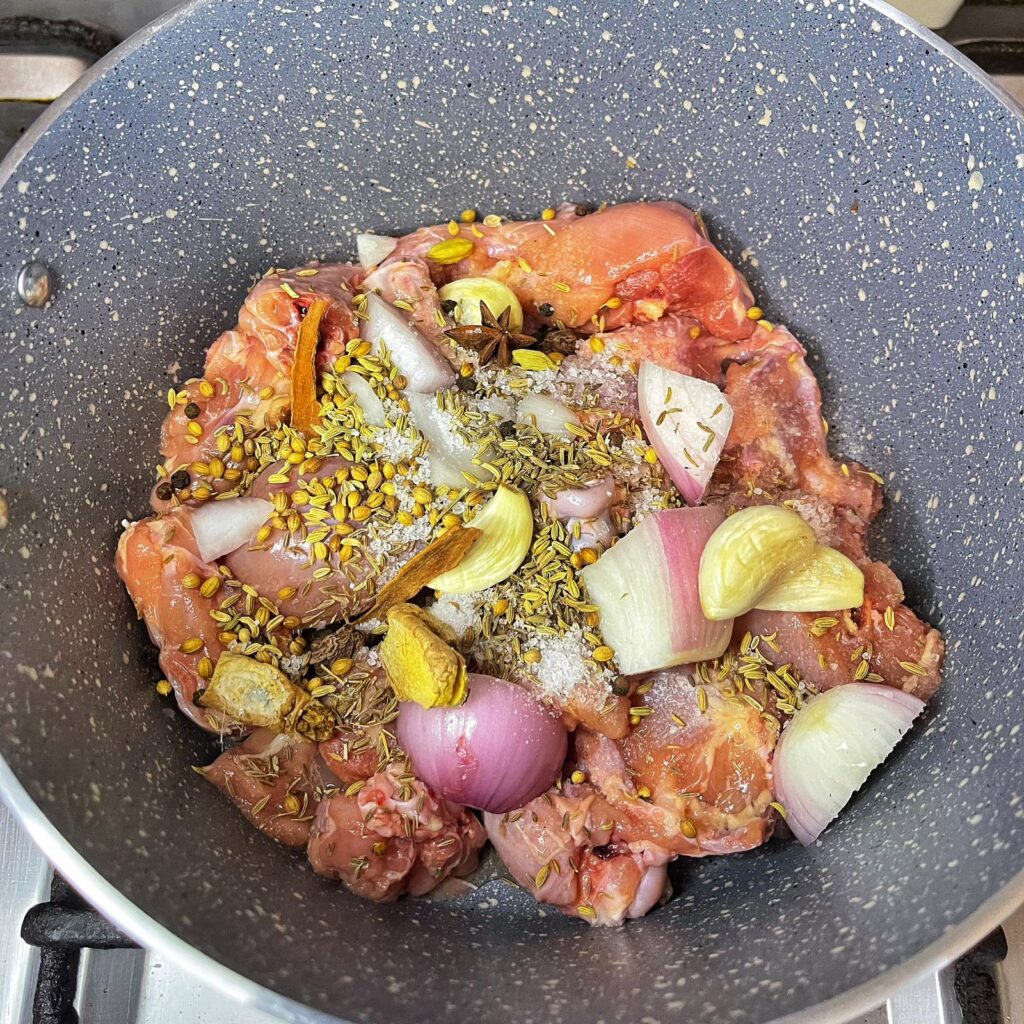 chicken simmered in all whole spices to make a yakhni.