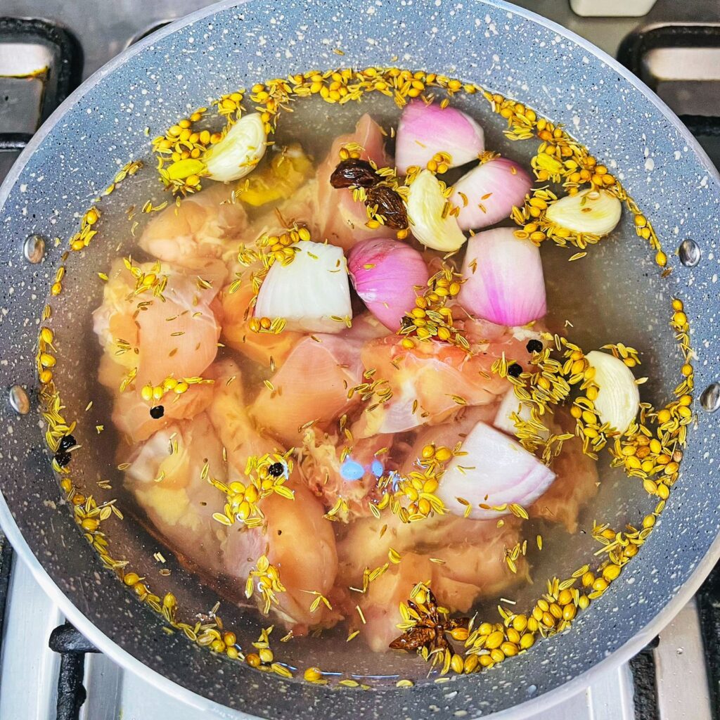 chicken simmered in all whole spices to make a yakhni.