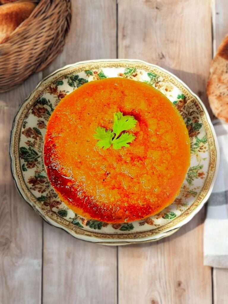 Tomato Onion Chutney arranged in neutral bowl on wooden table