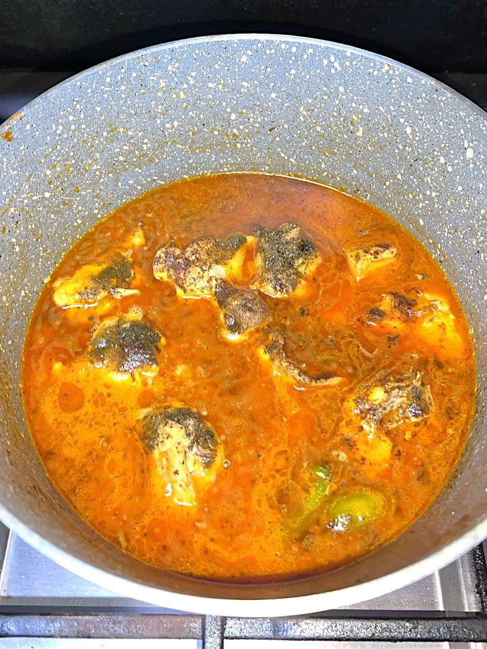 garam masala and kasuri meethi is sprinkled over chicken curry.