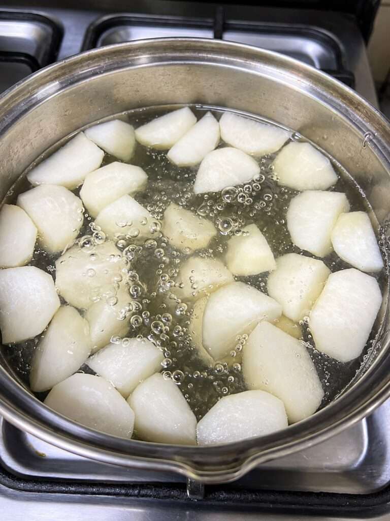 Turnips boiling in water before making shaljam gosht